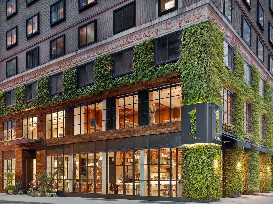 The planted façade and entrance of 1 Hotel Central Park in New York